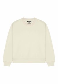 Šviesios kremų spalvos džemperis su apvalia iškirpte, ilgomis rankovėmis, prisiūtais riešutais ir apačia. Pagamintas iš minkštos medžiagos su minimaliais matomais siūlių detalėmis.