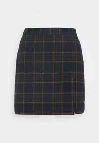 Marinblå rutiga mini kjol med en strukturerad silhuett i gröna och gula linjer, en sidsspringa och en mjuk textur.