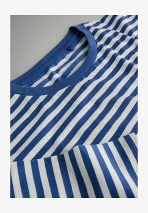 Mėlynos ir baltos spalvų dryžuota marškinėlių su ribuotu iškirpimu. Minkšta medžiaga su horizontaliomis juostomis, pasižymi švelnia tekstūra ir šiek tiek išlenktu apačios kraštu.