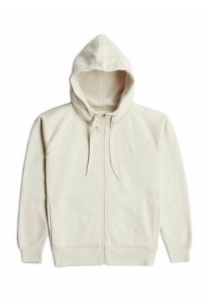 Beige zip-up hoodie with drawstrings, long sleeves, front pockets, and ribbed cuffs and hem, laid flat on a white background.