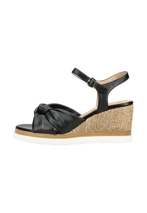 Sort læder kilehælssandal med knyttet forreste rem, ankelspænde, vævet jutesål og hvid rillede sål.