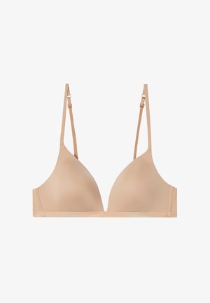 Nude-kleurige driehoekige beha met verstelbare bandjes, gladde textuur en minimalistisch ontwerp. Geen vulling of versieringen zichtbaar.