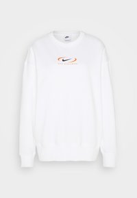 White sweatshirt featuring a round neckline, dropped shoulders, and a central Nike logo in black and orange. Smooth, soft texture.