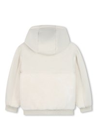 Hoodie color crema con un morbido retro in pelliccia sintetica e un frontale liscio e lucido. Presenta un cappuccio e polsini elastici sulle maniche.