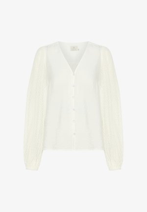 Blouse blanche avec un décolleté en V, fermeture à boutons et manches longues transparentes texturées. Tissu doux avec une finition légèrement froissée.