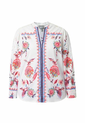 Witte blouse met lange mouwen en kleurrijke bloemenborduursels in rood, roze, blauw en groen, met een blauw-rode patroonachtige verticale streep in het midden.