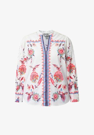 Witte blouse met lange mouwen en kleurrijke bloemenborduursels in rood, roze, blauw en groen, met een blauw-rode patroonachtige verticale streep in het midden.
