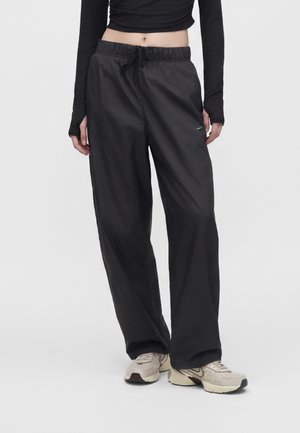 Nike Sportswear, REVERSIBLE - Долнище на анцуг - black/ridgerock