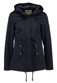 Veste à capuche bleu marine avec fermeture éclair à l'avant, deux poches latérales avec rabats, cordons ajustables à la taille et à l'ourlet, et une petite poche poitrine zippée.
