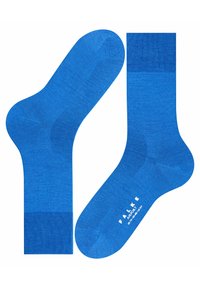 Blå sokker lavet af blødt, glat materiale. Har et ensfarvet design med ribbede manchetter og et logo trykt på sålen.