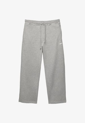 Gray sweatpants made of soft fabric with an elastic waistband, adjustable drawstring, and side pockets. Features a small white logo.