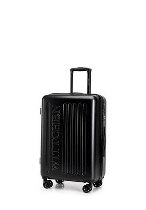 Black hard-shell suitcase with extended telescopic handle, four spinner wheels, vertical ridges, and "WITTCHEN" embossed on front.