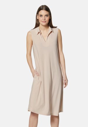 Elegantes beiges ärmelloses Kleid mit Kragen, V-Ausschnitt und seitlichen Taschen. Hergestellt aus weichem Stoff mit einer lockeren Passform, das bis zur Mitte des Oberschenkels reicht.
