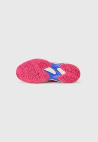 Shoe sole featuring a pink rubber surface with a textured grip pattern, blue accents, and a light-colored midsole for cushioning.