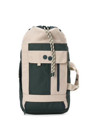 Beige and dark green backpack with front flap pocket, vertical zipper, drawstring closure, and side carrying handle.