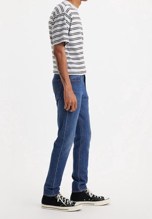 Jeans Tapered Fit - dark-blue denim