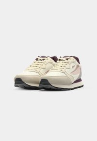 Light beige sneakers with purple accents, suede and mesh material, lace-up design, textured rubber sole, logo on sides.