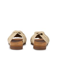 Beige slip-on sandals with a twisted upper design, brown sole, and smooth synthetic material. Open back and round toe.