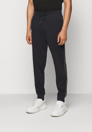 Pantalones deportivos - black