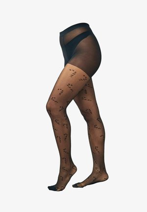 Schwarze gemusterte Strumpfhosen mit einem durchsichtigen oberen Abschnitt, der ein sich wiederholendes Muster von kleinen Fußabdrücken in dunklen Farbtönen auf einem transparenten Hintergrund zeigt.