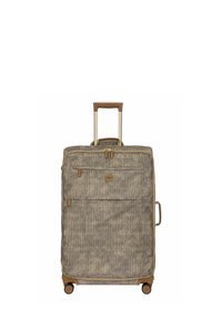 Valise à roulettes avec un extérieur en tissu texturé beige et marron, des accents dorés, une poignée rétractable et quatre roues pour la mobilité.