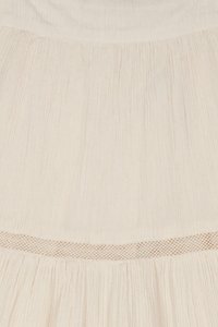 Light beige dress featuring vertical pleats, a textured fabric, and a decorative woven mesh band along the waistline.