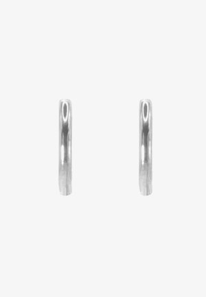 Silver hoop earrings with a smooth, polished finish. The design is simple and circular, showcasing a lightweight and minimal aesthetic.