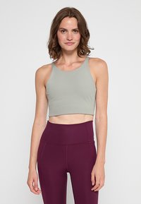 Sportmelltartó könnyű sportoláshoz - agave