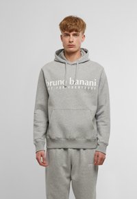 Felpa grigia con tasca frontale, cappuccio con coulisse e testo bianco. Realizzata in un tessuto morbido, presenta polsini e vita a coste.