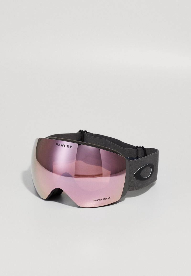 Maschera da sci nera con lente curva rosa, dotata di un cinturino regolabile e di un logo a contrasto sul lato. Superficie liscia.