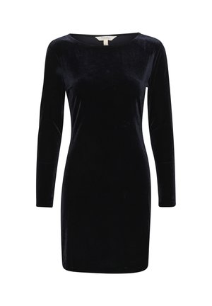 Abito lungo in velluto nero con maniche lunghe e scollatura a barca. Texture liscia, forma aderente, lunghezza fino al ginocchio e senza decorazioni visibili.