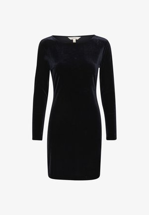 Abito lungo in velluto nero con maniche lunghe e scollatura a barca. Texture liscia, forma aderente, lunghezza fino al ginocchio e senza decorazioni visibili.