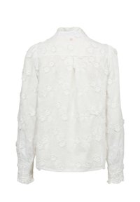Blouse blanche à manches longues avec broderie florale, col haut et poignets smockés, vue de dos sur fond blanc.