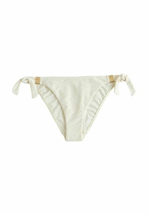 Off-white bikinihousut, joissa hienovarainen geometrinen kuvio, sivusoljet ja pienet puiset rengasdetailit valkoisella taustalla.