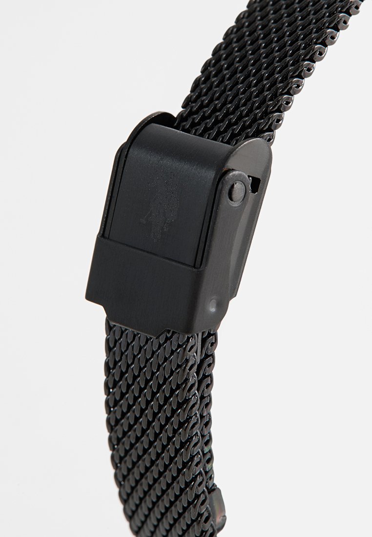 Schwarzes Metall-Mesh-Uhrenarmband mit robustem, strukturiertem Design. Verfügt über einen sicheren Verschlussmechanismus und eine elegante Oberfläche.