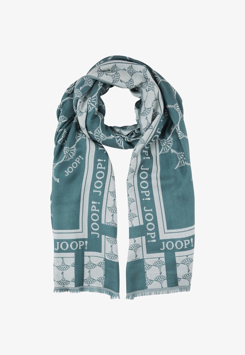 Écharpe tissée bleu sarcelle et grise avec motif botanique et texte répété "JOOP!", bords frangés, pliée en boucle lâche.