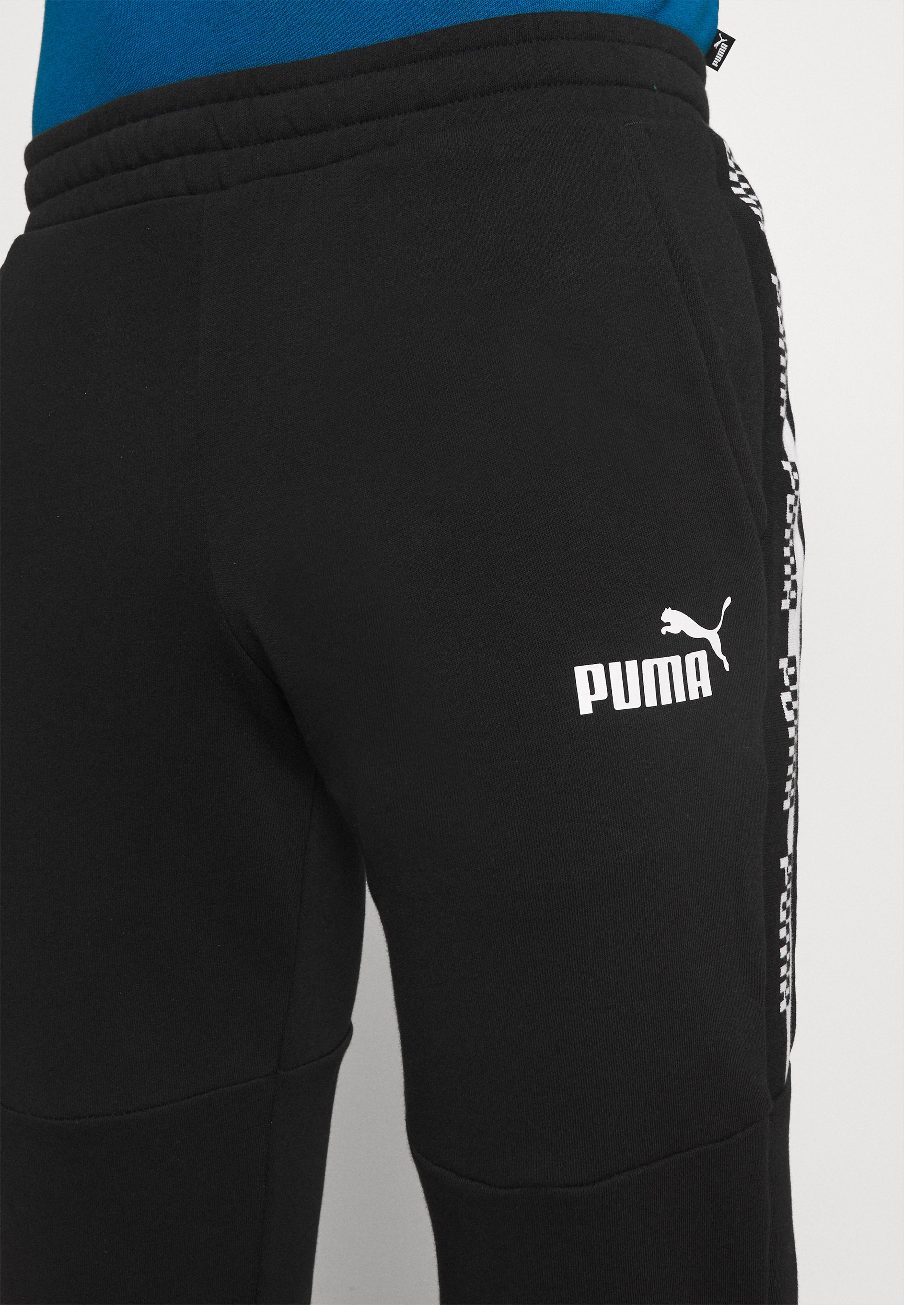Puma AMPLIFIED PANTS - Pantalones deportivos - black/negro - Zalando.es