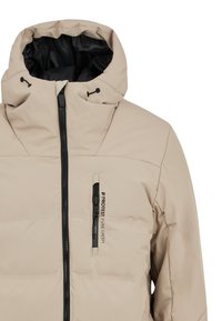 Doudoune beige avec fermeture éclair à l'avant et intérieur noir. Caractéristiques : capuche réglable, poignets élastiques et logo visible sur la poitrine.
