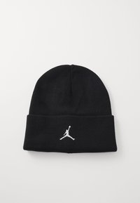 Beanie noir en tricot avec un revers. Présente un logo Jumpman brodé en blanc sur le devant. Texture douce, design ajusté.