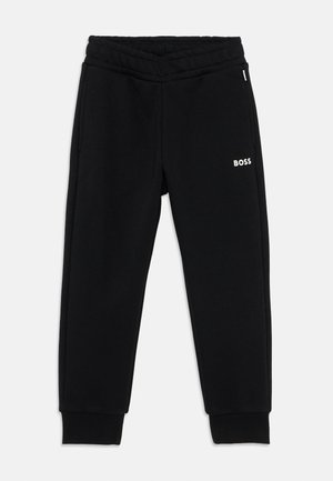 Pantalons de survêtement en coton noir avec une taille côtelée, des chevilles effilées et un petit logo blanc "BOSS" sur le côté gauche.
