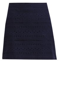Jupe bleu marine avec un design texturé présentant des formes alternées et des motifs découpés, fabriquée en tissu léger.