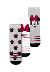Tre paia di calze: un paio bianco con accenti a strisce nere e rosse, un paio grigio con sagome nere e rosse di Minnie Mouse, un paio grigio con il volto di Minnie Mouse.
