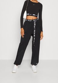 Nike Sportswear Tygbyxor - black