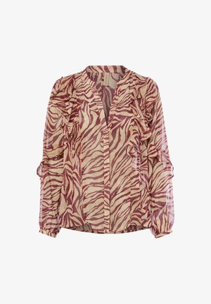 Sheer blouse with a zebra print pattern in rust and beige. Features ruffled accents along the front and sleeves, with a casual fit.