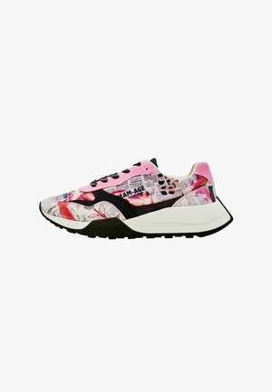 Multicolored sneaker featuring a graphic print with newspaper motifs, a pink suede upper, black accents, and a chunky white sole.