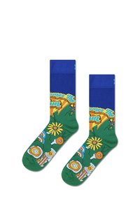 Chaussettes en coton multicolores avec des poignets bleus et des motifs floraux vifs en vert, jaune et orange, comportant le texte "Here Comes the Sun".