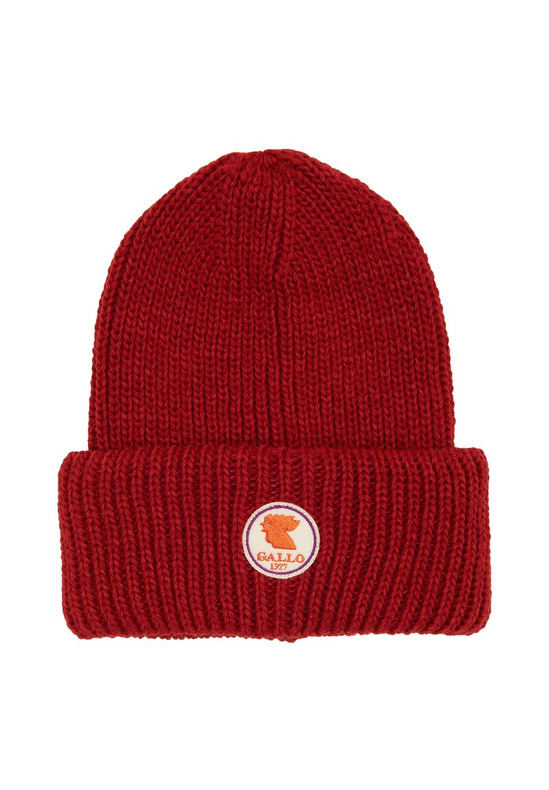 Red knitted beanie hat with a folded cuff. Features a circular logo patch showing a profile of a lion with "Gallo 1927" text.