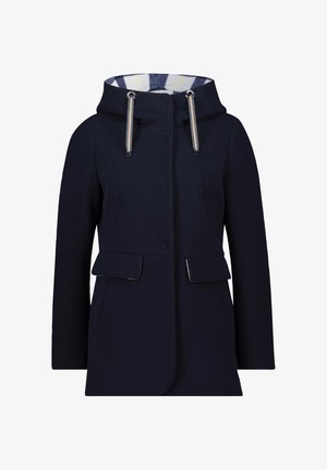 Navy blue wool coat with a hood featuring striped lining and drawstrings, front snap buttons, and two flap pockets at the waist.