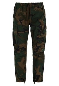 Camouflage cargo pants in green, brown, and black. Features an elastic waistband with drawstring, side pockets, and tapered cuffs.