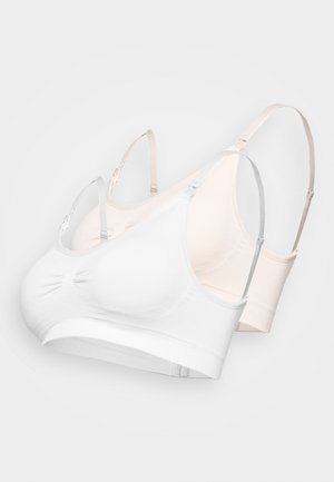 To trådløse bh-er i hvit og lys beige. De har justerbare stropper, glatte stoffer, samlet midtparti og brede underbånd.